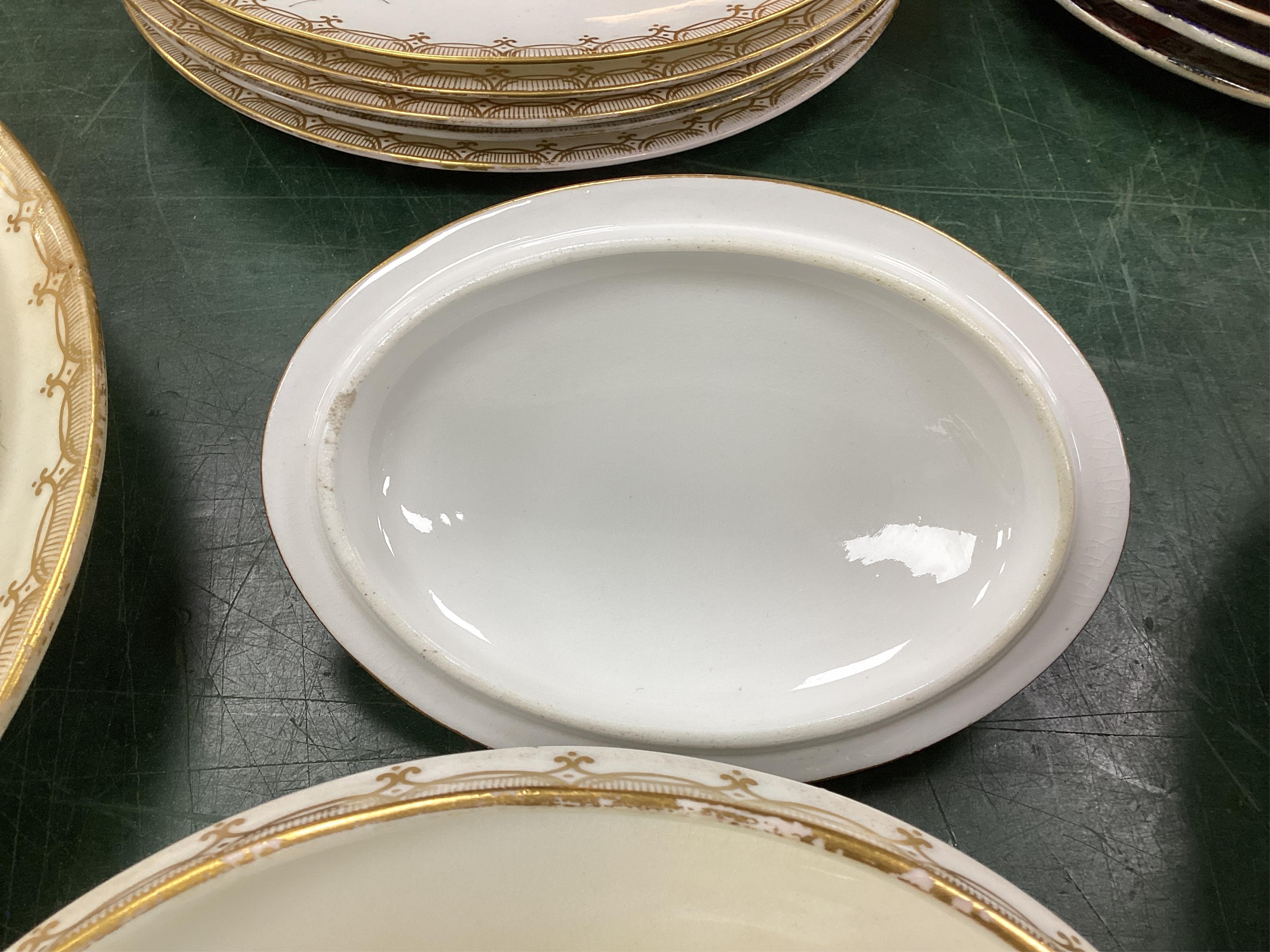 A Coalport bird painted part dinner service, mid 19th century